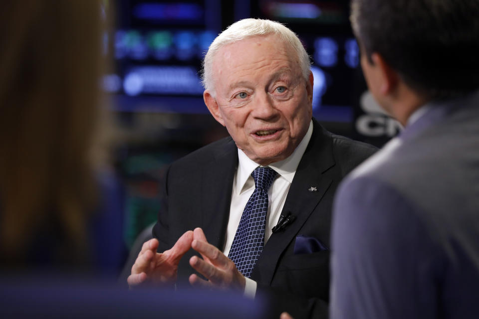 Jerry Jones talks on a cable TV news set. 