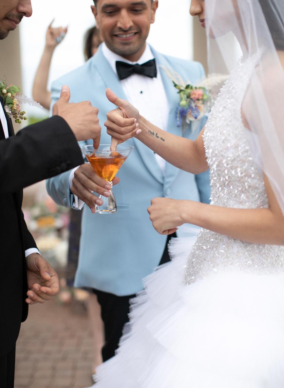 My man of honor, David, bringing us honey to dip our fingers into and feed each other, to represent always being sweet and kind to each other. Traditionally, the bride is supposed to bite the finger of the groom when he feeds her the honey, to tease him that his wife is sweet and feisty!