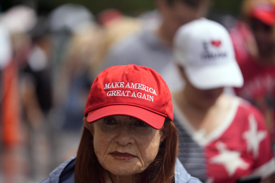 People arrive before Republican presidential candidate former President Donald Trump speaks at his birthday celebration, hosted by Club 47, in West Palm Beach, Fla., Friday, June 14, 2024. (AP Photo/Gerald Herbert)