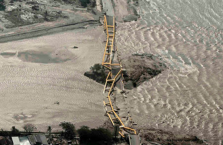 An aerial view shows bridge damaged by an earthquake and tsunami in Palu, Central Sulawesi. Antara Foto/Muhammad Adimaja via REUTERS