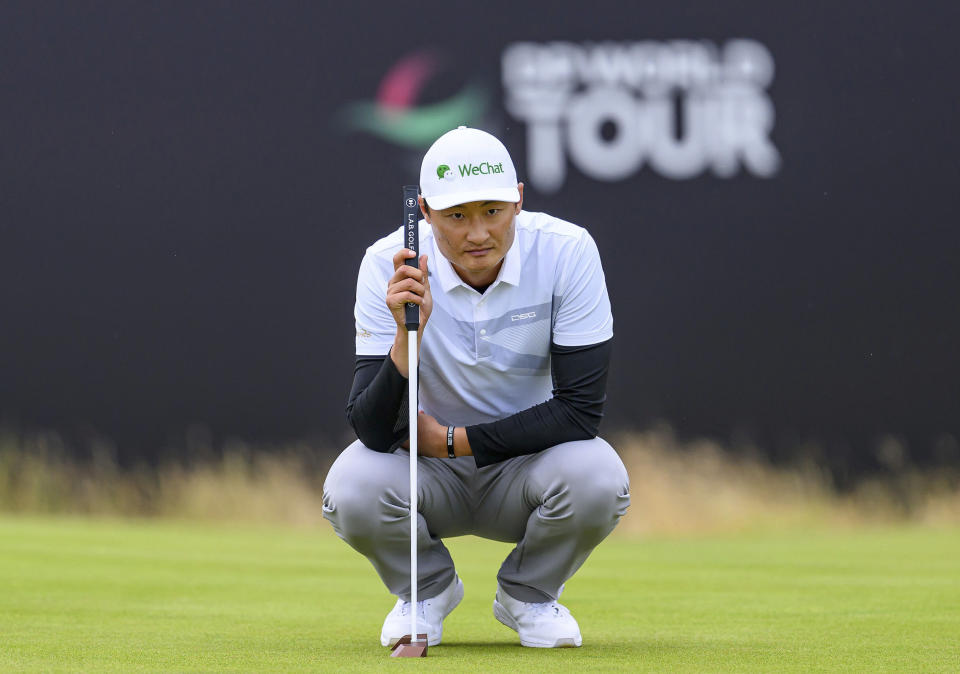 China's Haotong Li on the 18th green on day one of the Scottish Open at The Renaissance Club, North Berwick, Scotland, Thursday July 11, 2024. (Malcolm Mackenzie/PA via AP)