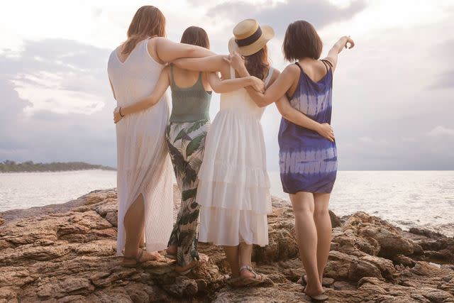 <p>Getty</p> Four women on the beach