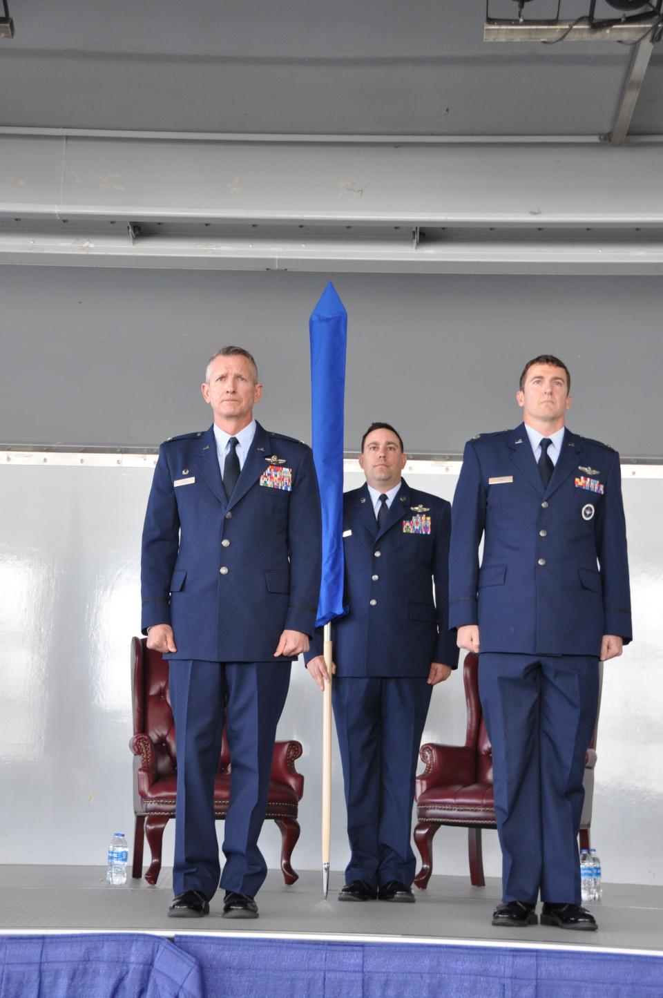 U.S. Air Force Col. Derek Price, commander of the 58th Operations Group, left, and Lt. Col. Derek Cumbie, commander of the 58th OG Detachment 3, right, prepare to unfurl the 58th OG Det 3 guidon during the unit’s activation ceremony Jan. 31, 2024, at Maxwell Air Force Base, Alabama. Det. 3 is the active associate unit to the 908th Airlift Wing for their new mission as the formal training unit for the MH-139A Grey Wolf helicopter.