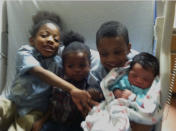 In this December 2012 photo provided by Latanya Byrd, shown from left, are siblings Saa'deem Griffin, Saa'sean Williams, Saa'yon Griffin and Saa'mir Williams. Saa'yon Griffin's mother Samara Banks and his three brothers were struck by a car and killed in 2013 while crossing Roosevelt Boulevard in Philadelphia. (Latanya Byrd via AP)