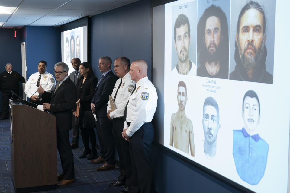 Philadelphia District Attorney Larry Krasner, at podium, speaks along side projected images of suspect Elias Diaz during a news conference in Philadelphia, Tuesday, Dec. 19, 2023. Authorities say Diaz, accused of slashing people with a large knife while riding a bicycle on a rail trail in Philadelphia is now a person of interest in the cold-case murder of a medical student that occurred among a series of high-profile sexual assaults two decades ago. (AP Photo/Matt Rourke)