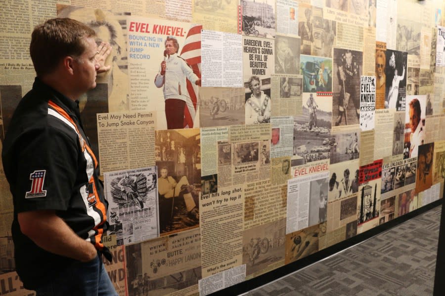 Mike Patterson, owner of historic Harley-Davidson and founder of The Evel Knievel Museum in Topeka, Kansas, surveys the wall of news clippings about the daredevil stunt rider in his Evel Knievel Museum on June 21, 2017. (Photo credit should read BETH LIPOFF/AFP via Getty Images)