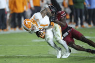 Tennessee wide receiver Cedric Tillman (4) is tackled by South Carolina defensive back Marcellas Dial (24) during the first half of an NCAA college football game Saturday, Nov. 19, 2022, in Columbia, S.C. (AP Photo/Artie Walker Jr.)