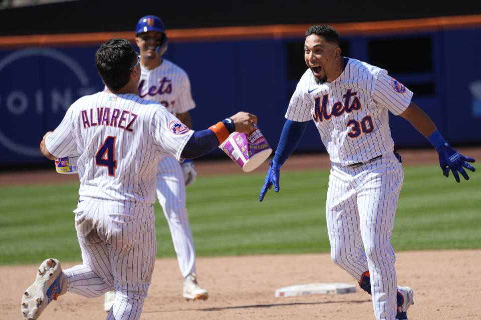 New York Mets' Rafael Ortega (30) reacts after hitting a walk off single during the ninth inning of a baseball game against the Los Angeles Angels, Sunday, Aug. 27, 2023, in New York. The Mets won 3-2. (AP Photo/Mary Altaffer)