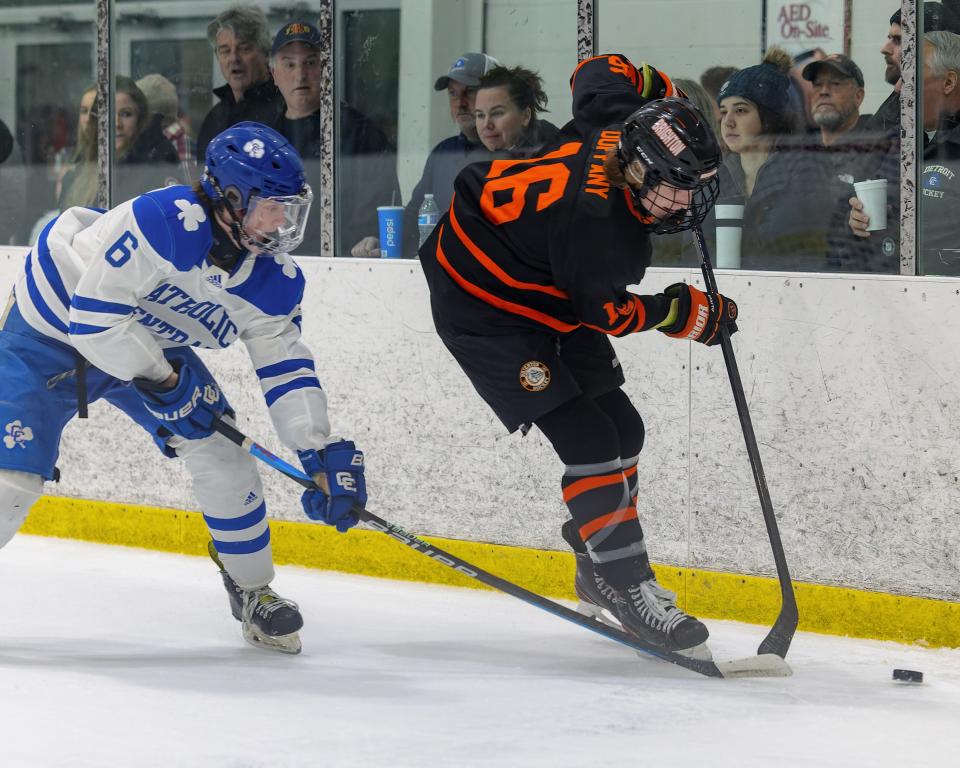 Brighton's Cameron Duffany (16) is pursued by Detroit Catholic Central's Joe Curtin (6) during the Bulldogs' 2-1 loss Saturday, Dec. 10, 2022 at Eddie Edgar Ice Arena.
