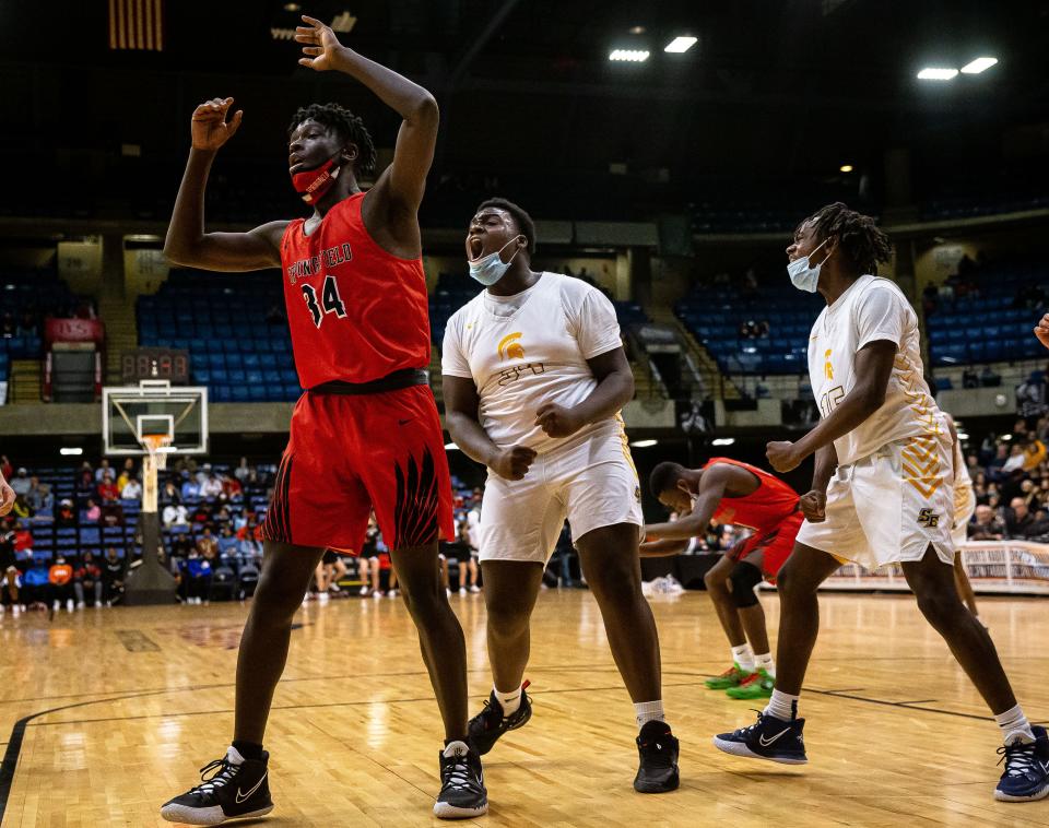 Southeast's Jaylene Simmons (34) screams out after getting the foul and the basket against Springfield's Brandenn Robinson (34) in overtime during the Showcase Saturday at the Bank of Springfield Center  in Springfield, Ill., Saturday, December 4, 2021. [Justin L. Fowler/The State Journal-Register] 