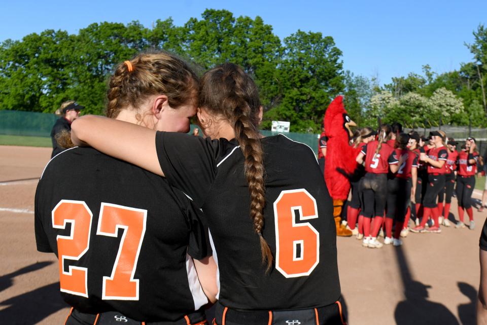 Marlington's Chyanne Knapp and Ava Collins hug as Canfield celebrates its Division II regional final win, Friday, May 26, 2023, at Nordonia.