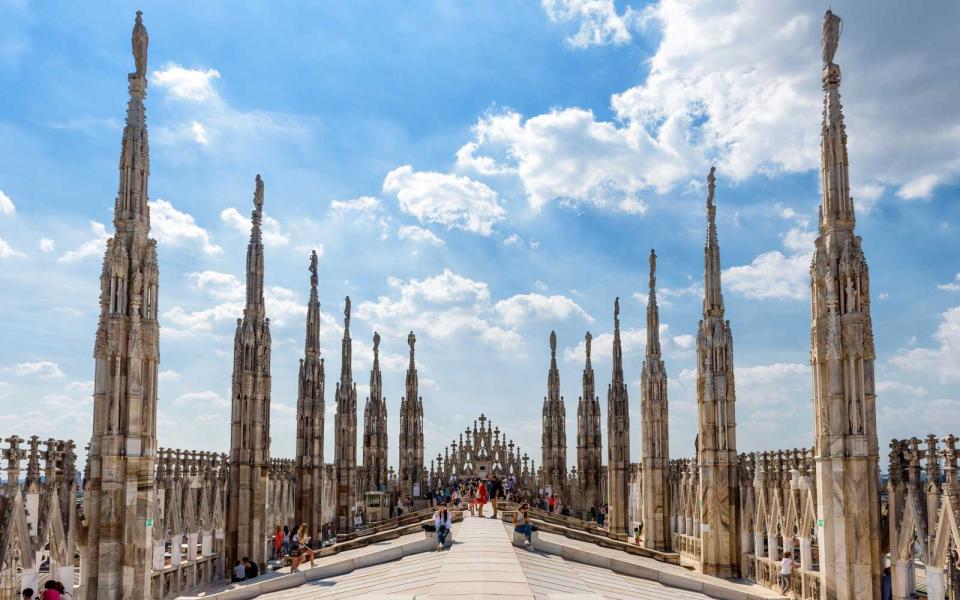 Tourists visit the roof of the Milan Cathedral (Duomo di Milano).