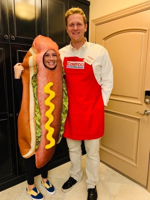 Someone dressed as Costco employee and another dress as a hot dog