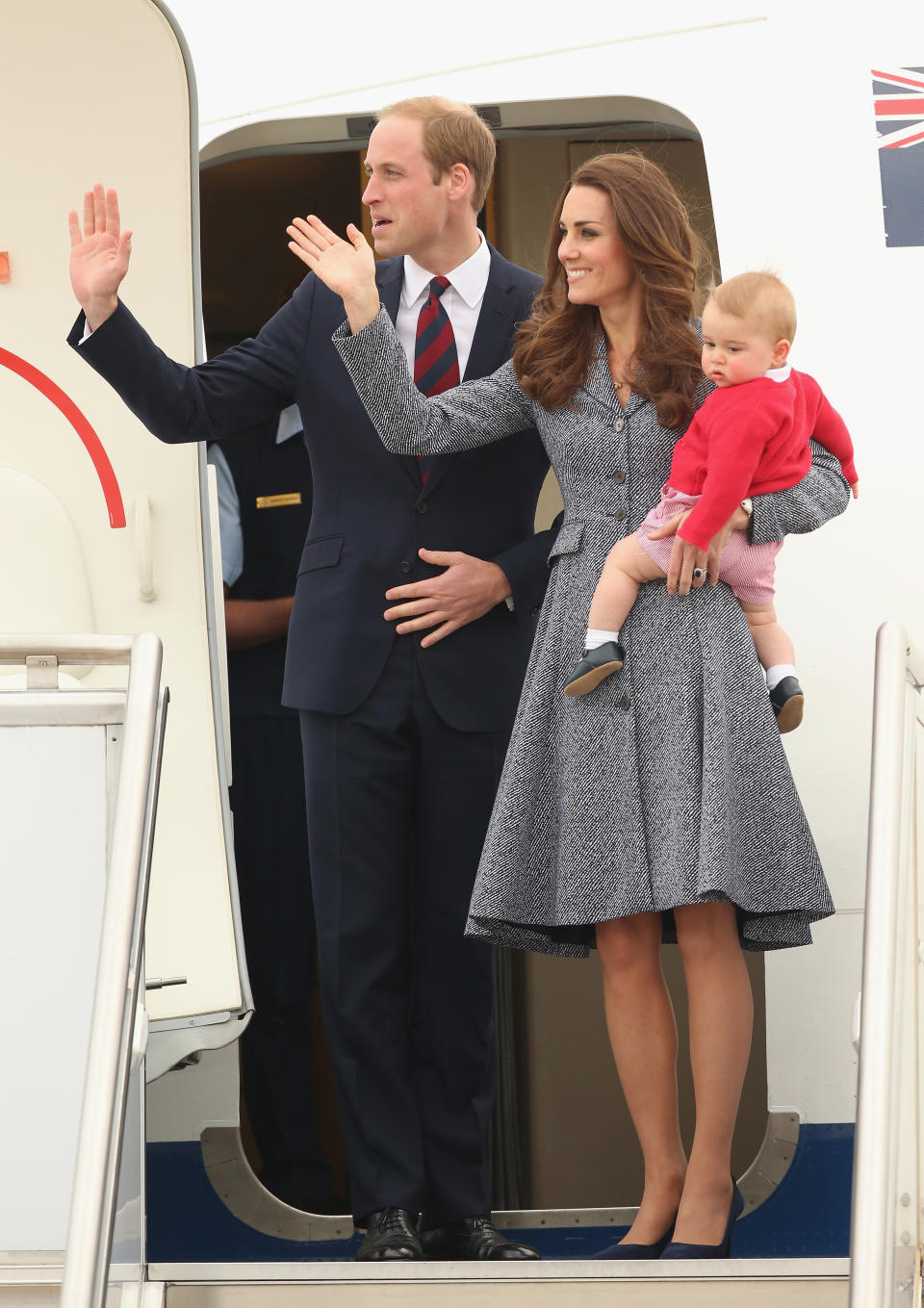 <p>The Duke and Duchess of Cambridge left Canberra on April, 25. For his flight home, Prince George wore red striped dungarees with a matching cardigan. <em>[Photo: Getty]</em> </p>