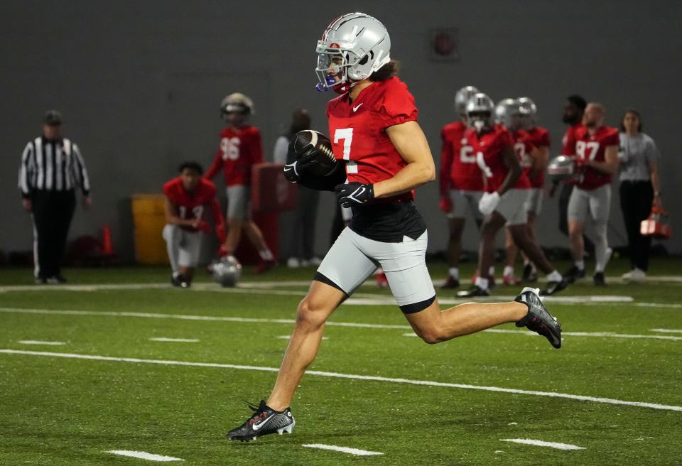 Mar 7, 2024; Columbus, OH, USA; Ohio State Buckeyes wide receiver Kyion Grayes (7) catches a pass during spring football practice at the Woody Hayes Athletic Center.