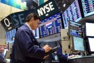 A trader works on the floor of the New York Stock Exchange at the closing bell on July 23. Facebook shares have lost nearly half their value since a highly-touted public offering in May, but it's still not a bargain for some investors