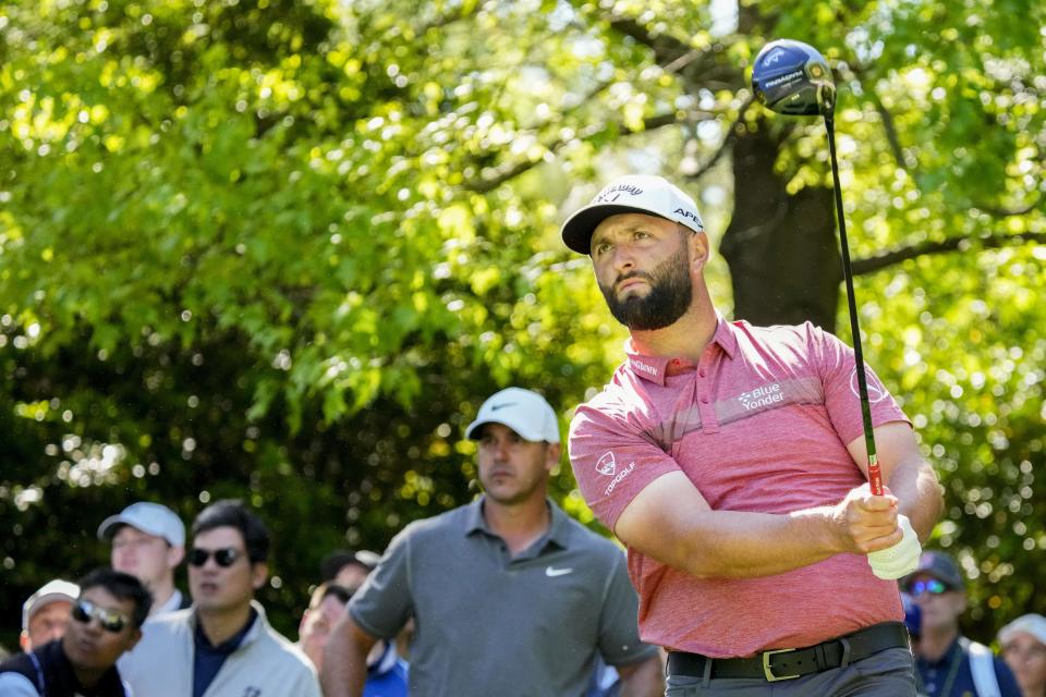 Apr 9, 2023; Augusta, Georgia, USA; Brooks Koepka watches as Jon Rahm tees off on the seventh hole during the final round of The Masters golf tournament. Mandatory Credit: Rob Schumacher-USA TODAY Network