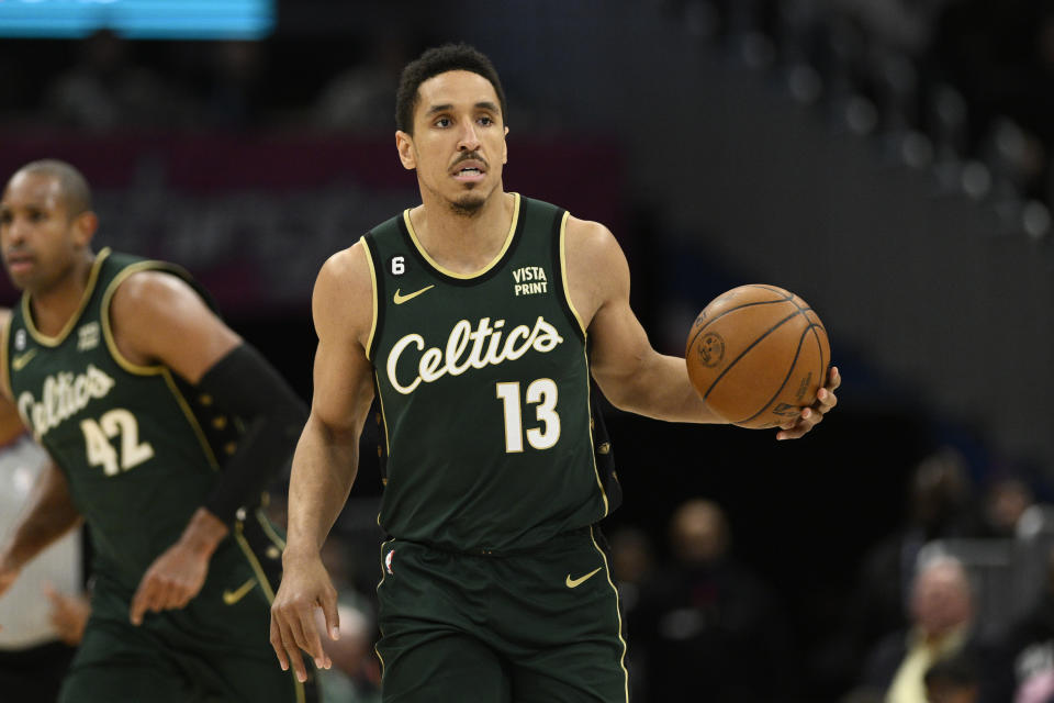 Boston Celtics guard Malcolm Brogdon (13) in action during the second half of an NBA basketball game against the Washington Wizards, Tuesday, March 28, 2023, in Washington. (AP Photo/Nick Wass)