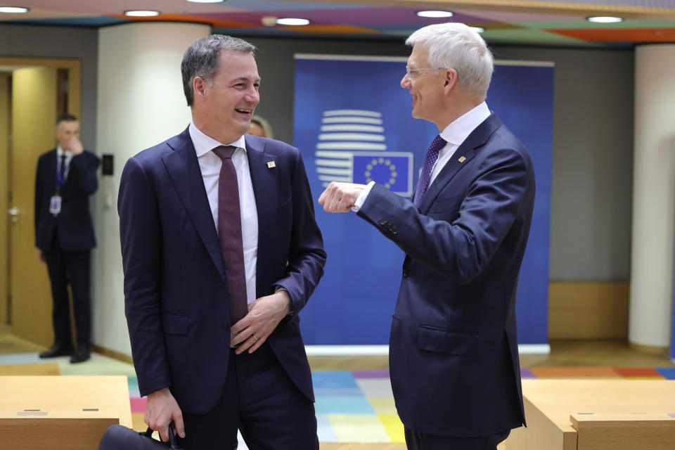 Belgium's Prime Minister Alexander De Croo, left, speaks with Latvia's Prime Minister Krisjanis Karins during a round table meeting at an EU summit in Brussels, Thursday, March 23, 2023. European Union leaders meet Thursday for a two-day summit to discuss the latest developments in Ukraine, the economy, energy and other topics including migration. (AP Photo/Olivier Matthys)