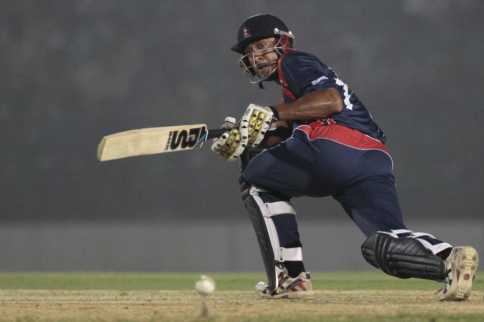 Nepal’s Paras Khadka plays a shot during a warm-up cricket match against Ireland ahead of the Twenty20 World Cup Cricket in Fatullah, near Dhaka, Bangladesh, Wednesday, March 12, 2014. (AP Photo/A.M. Ahad)