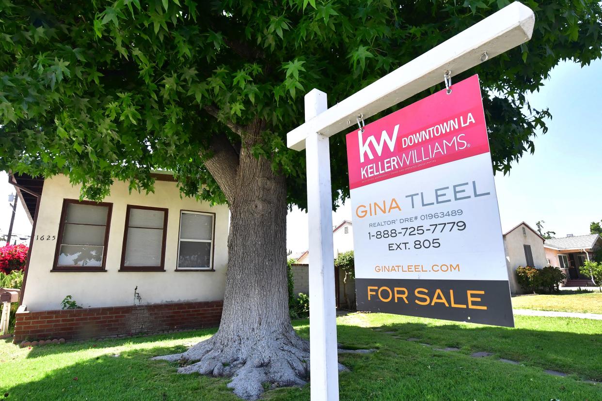 A sign of a home for sale is pictured in Alhambra, California on May 4, 2022. - The US central bank announced its biggest interest rate hike in over twenty years as it deals with fast rising prices in the US economy. (Credit: Frederic J. BROWN, AFP via Getty Images)