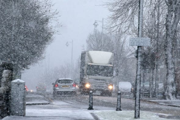 Arctic winds will make it feel like -13C today as six inches of snow sweeps in