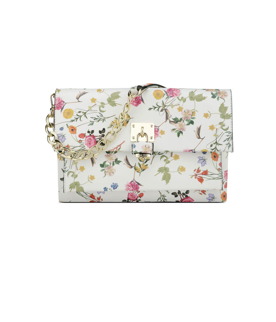 <p>Fausta Foldover Clutch, $69, <a rel="nofollow noopener" href="http://www.ninewest.com/Fausta-Foldover-Clutch/31023560,default,pd.html?variantColor=JJ2JJ0D&cgid=8346270" target="_blank" data-ylk="slk:ninewest.com;elm:context_link;itc:0;sec:content-canvas" class="link ">ninewest.com</a> </p>