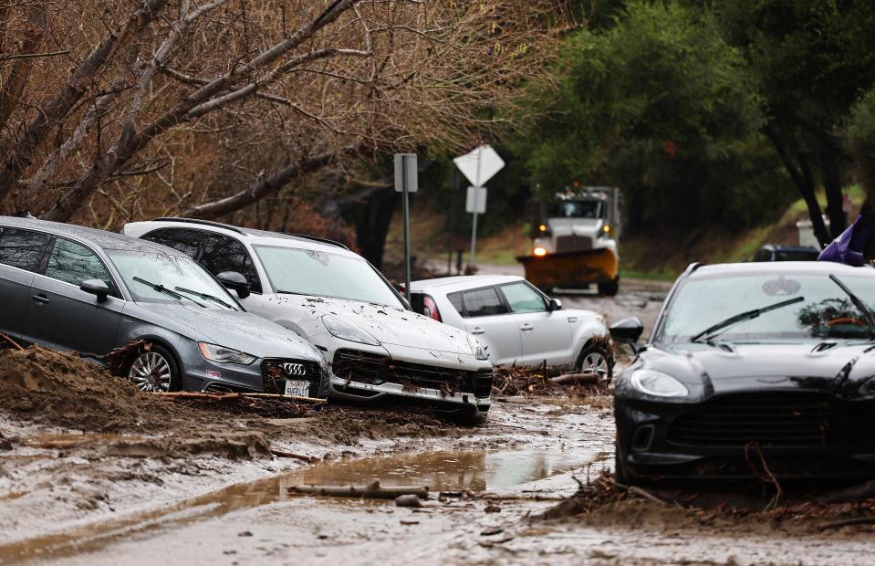 Vehicles damaged by flooding remain stuck as a powerful long-duration atmospheric river storm, the second in less than a week, impacted Southern California on February 5, near Malibu, California. More storms are on the way for California this weekend and over the next few days.