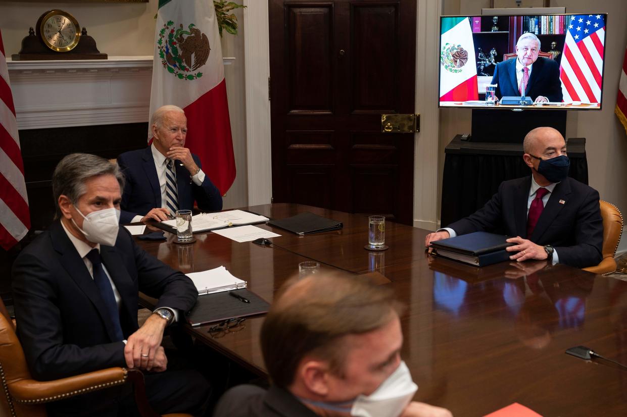US President Joe Biden (C), flanked by US Secretary of State Antony Blinken (L) and US Secretary of Homeland Security Alejandro Mayorkas (R), meets virtually with Mexican  President Andres Manuel Lopez Obrador at the White House in Washington, DC, on March 1, 2021. (Photo by JIM WATSON / AFP) (Photo by JIM WATSON/AFP via Getty Images)