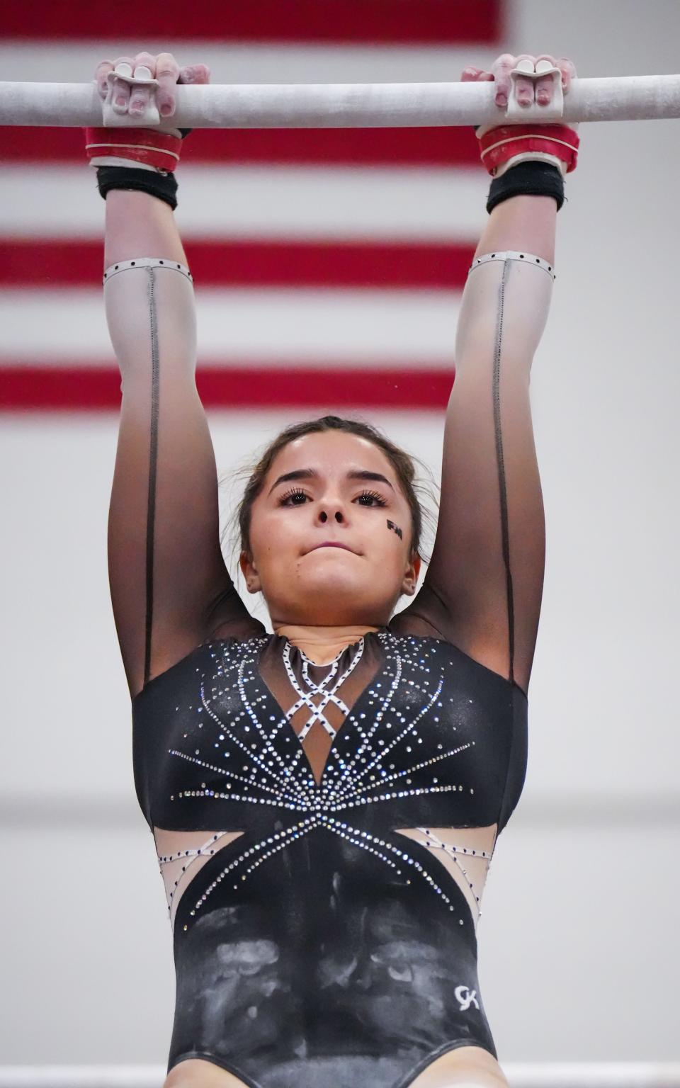 Franklin/Muskego co-op gymnast Ellie Johnson, shown in a WIAA Division 1 sectional on Feb. 23, 2023, helped Franklin/Muskego win a team gymnastics title Saturday.