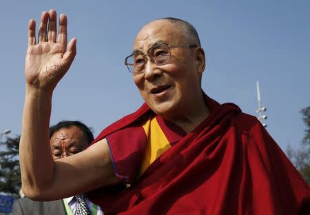 Tibetan spiritual leader the Dalai Lama waves to devotees outside the United Nations where the Human Rights Council is holding it's 31st Session in Geneva, Switzerland, March 11, 2016. REUTERS/Denis Balibouse