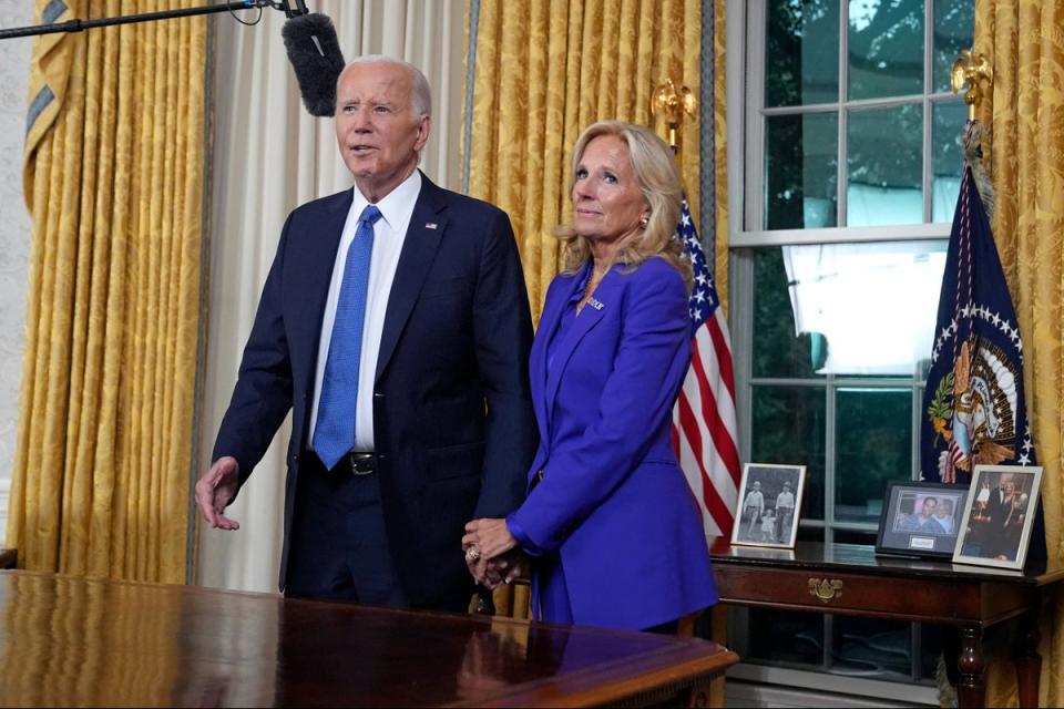 President Joe Biden stands next to First Lady Jill Biden as he was set to address the nation live on Wendesday (POOL/AFP via Getty Images)