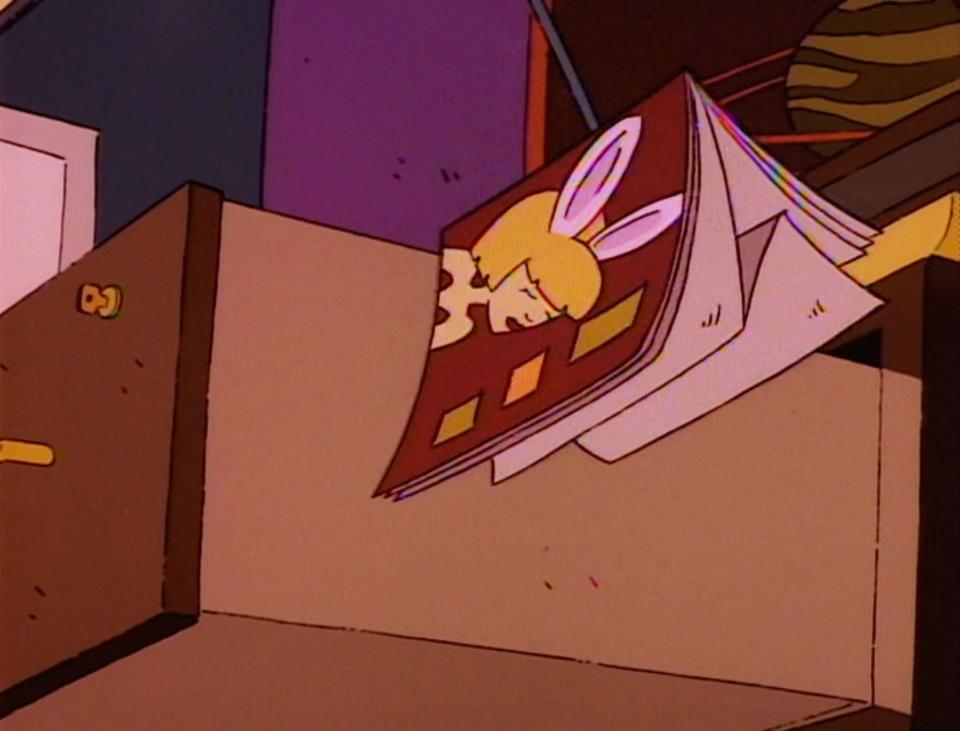 a playboy magazine flying out of howard's drawer on rugrats