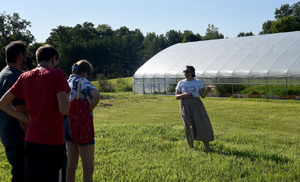 Amy Hurst, Director of Operations at Learning 4 Life Farm near Johnstown, gives a tour of where rain gardens will be built near the existing hoop house on Friday, July 22, 2022. The farm, which provides education and job training for students on the autism spectrum, held a summer open house to celebrate the construction of the new barn for alpacas and expanding of their farm facilities and growing gardens.