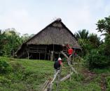 ‘Uma’: Used to held ceremonies and rituals, this uma is owned by a sikerei who lives in Butui village on Siberut Island. Uma are predominantly made from wood with roofs made from thatched sago leaves. Their high construction costs mean that sikerei are fairly well-off. (