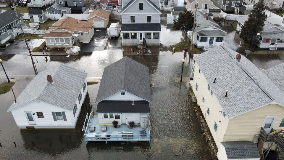Homes surrounded by flooding in Hampton, New Hampshire, on January 10, 2024. Climate change is causing storms in both summer and winter.  -Lauren Owens Lambert/AFP/Getty Images