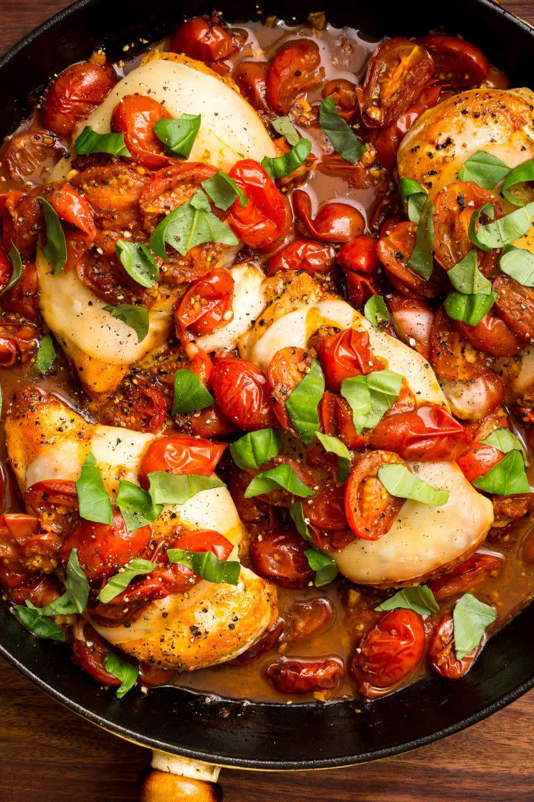 <p>Tomatoes cooked in balsamic vinegar are the perfect sweet-tart compliment to this cheesy chicken.</p><p>Get the recipe from <a href="/cooking/recipe-ideas/recipes/a47169/caprese-chicken-recipe/" data-ylk="slk:Delish;elm:context_link;itc:0;sec:content-canvas" class="link ">Delish</a>.</p>