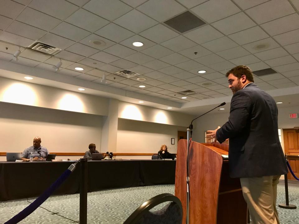 Lansing Economic Area Partnership Director of Business Attraction Dillon Rush speaks about ATESTEO tax incentives at East Lansing City Council's meeting on May 24, 2022.