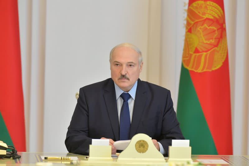 FILE PHOTO: Belarusian President Lukashenko chairs a meeting in Minsk