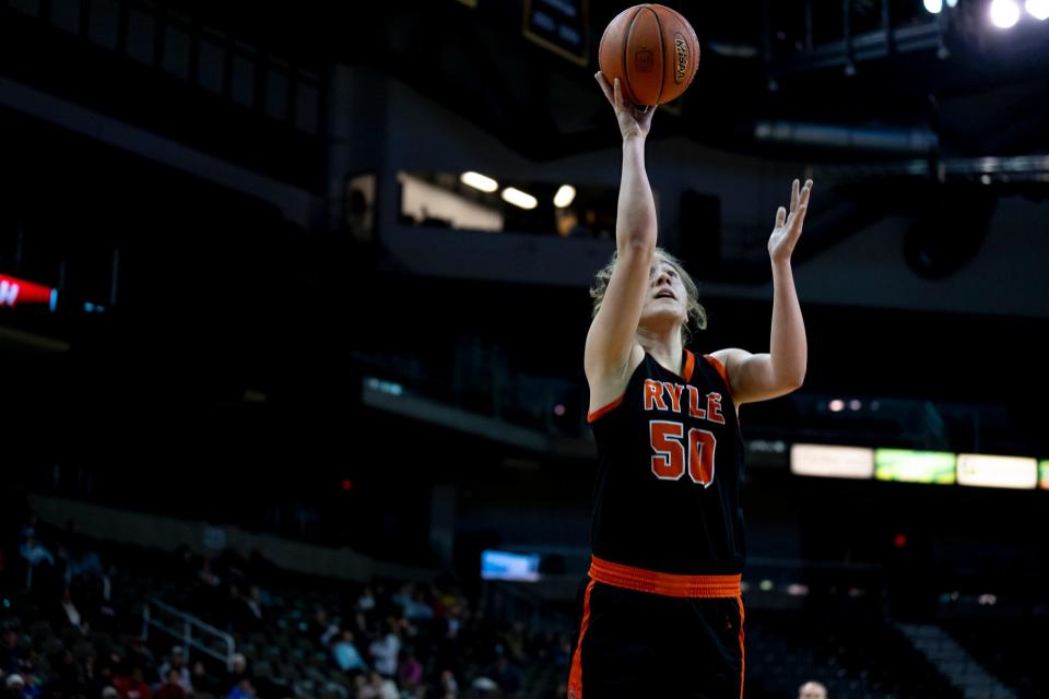 Ryle center Sarah Baker (50) scores in the first quarter of the KHSAA Regional Semi-final game between Holy Cross and Ryle at Northern Kentucky University’s Truist Arena in Heighland Heights, Ky., on Friday, March 3, 2023. 