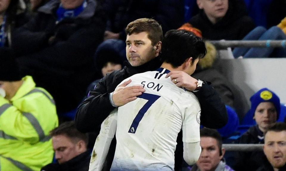 Son Heung-min, one of the Tottenham scorers, is congratulated by the manager, Mauricio Pochettino, as he is substituted.