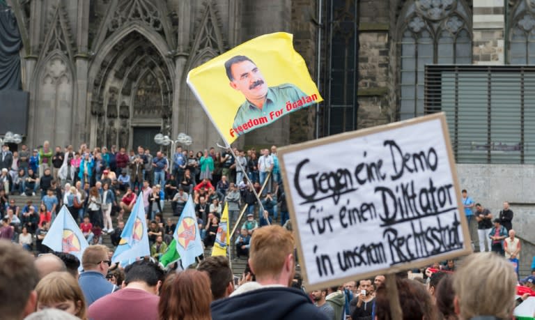 Protestors hold a flag of Kurdish Leader Abdullah Ocalan during a counter-demonstration to protest against a rally held by supporters of Turkish President Recep Tayyip Erdogan on July 31, 2016 in Cologne