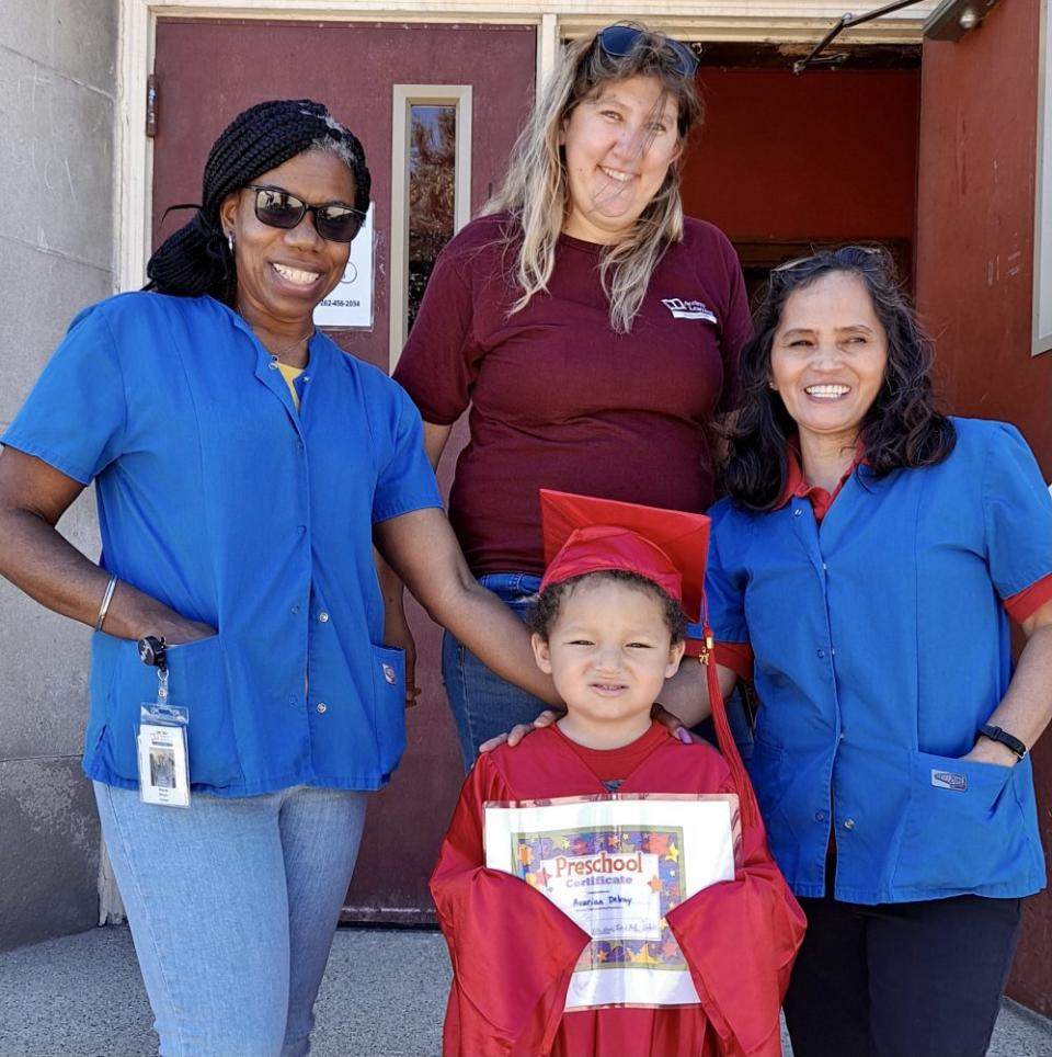 Five-year-old Avarian Delray with teachers Wanda Brown (L-R), Heidi Hoefs and and Lalaine Ratz at Acelero Learning in Racine, Wisconsin. (Sharon Larson)