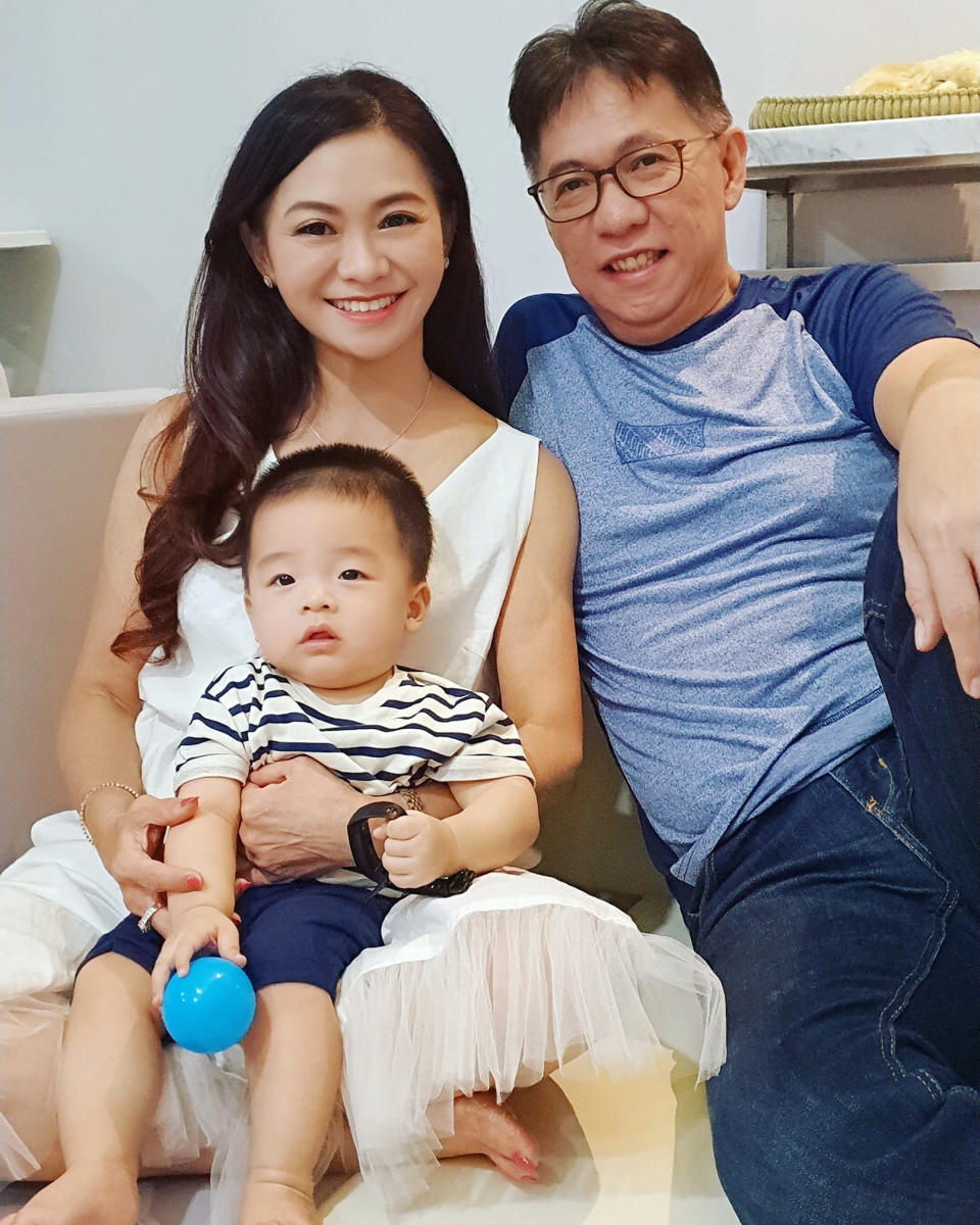 Puspa Dewi with husband Hadi and grandchild