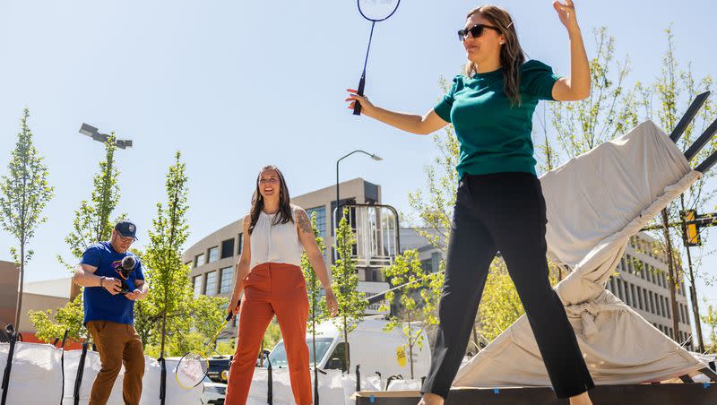 Salt Lake City Mayor Erin Mendenhall, center, and Salt Lake City Council member Ana Valderomos, right, play badminton during the unveiling of the “Green Loop,” a temporary public park at 200 East 300 South in downtown Salt Lake City on Monday, May 1, 2023.