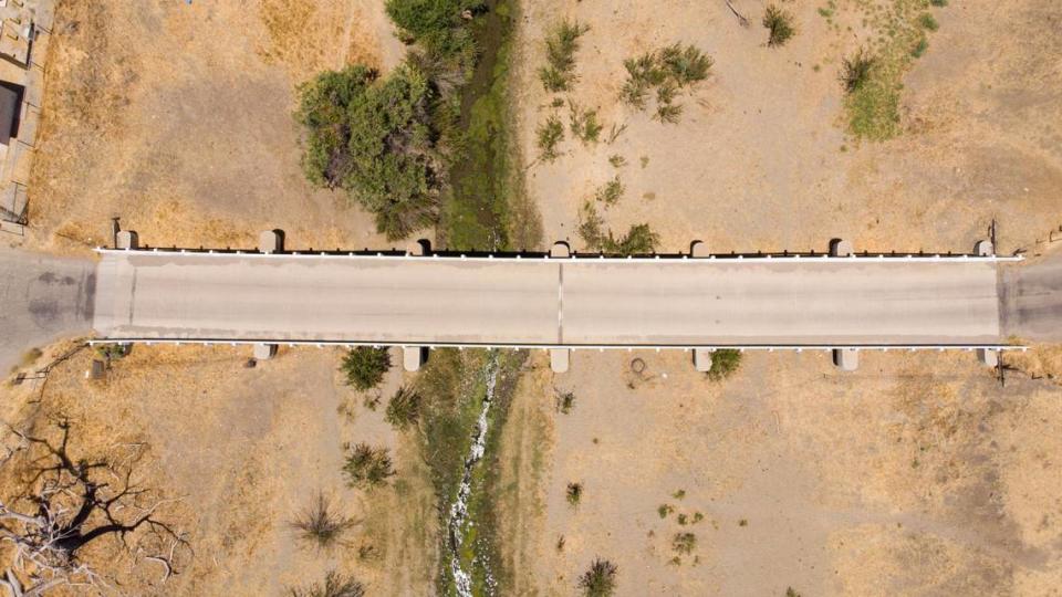 The bridge leading into Parkfield spans the San Andreas Fault and connects the Pacific and North American plates. A view from above shows how the guardrails are gently bent toward the north on the western side. Engineers designed the bridge with an expansion joint in the center to accommodate the fault’s movement.
