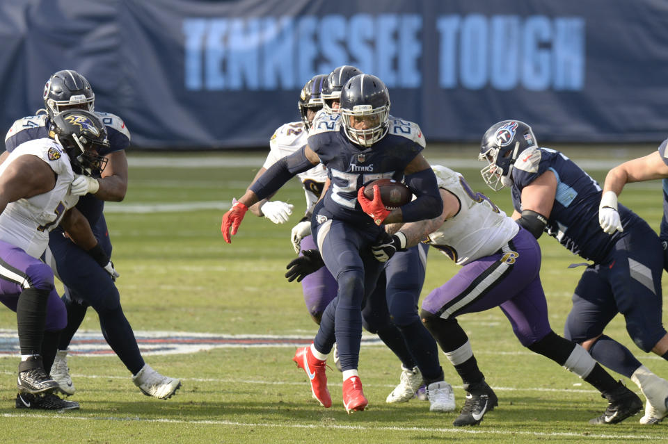 Tennessee Titans running back Derrick Henry (22) carries the ball against the Baltimore Ravens in the second half of an NFL wild-card playoff football game Sunday, Jan. 10, 2021, in Nashville, Tenn. (AP Photo/Mark Zaleski)