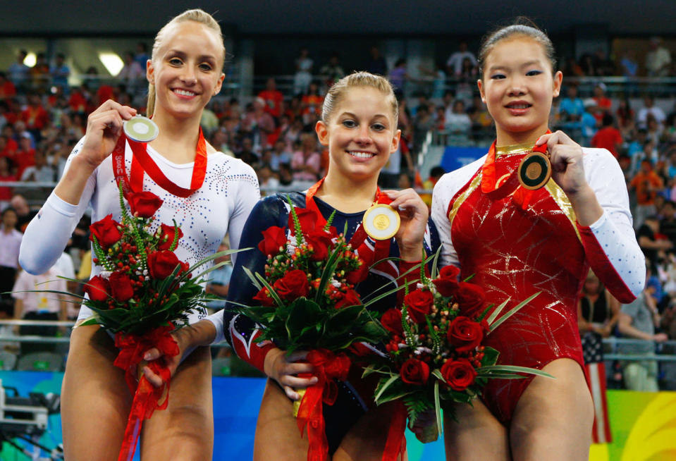 (L-R) Silver medalist Nastia Liukin of the USA, gold medalist Shawn Johnson of the USA and bronze medalist Cheng Fei of China pose on the podium during the medal ceremony for the Women's Beam Final at the National Indoor Stadium on Day 11 of the Beijing 2008 Olympic Games on August 19, 2008 in Beijing, China.