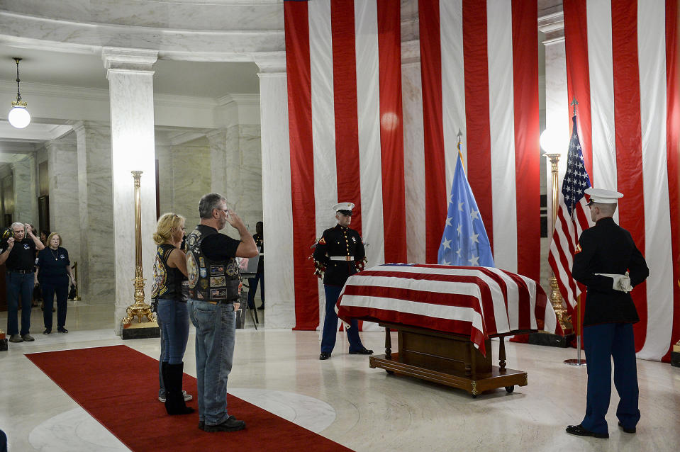 People salute the casket of Hershel "Woody" Williams set up in the first floor rotunda of the West Virginia State Capitol in Charleston, W.Va., for visitation on Saturday, July 2, 2022. Williams, 98, a West Virginian who was the last living Medal of Honor recipient from World War II, died on Wednesday, June 29. His funeral is set for Sunday, July 3. (Chris Dorst/Charleston Gazette-Mail via AP)