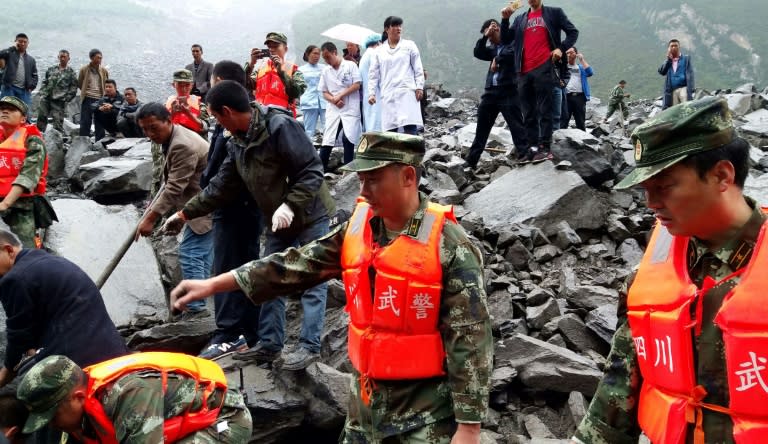 Some 3,000 workers with life-detection equipment are taking part in the search for people still missing in the landslide